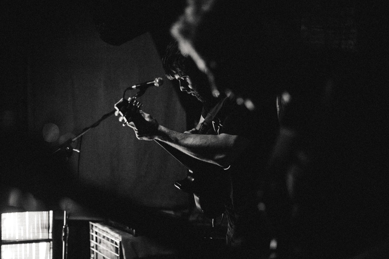 NOSTRA is a Latvian-French trio formed in Riga (Latvia) in 2016, drawing its musical influences from various genres, from post-rock and post-metal to cold wave, including sludge or doom jazz. The band has been immersed in a post-Soviet urban landscape scattered with crumbling buildings and abandoned industrial complexes. This ‘post’ environment where nature slowly sprawls through cracks, concrete and metallic edifices have been haunting Nostra’s music. After the release of Transmission(s) (EP, 2018) and Nemoralis (LP, 2019), Nostra is coming back with a two-title single: Law of the Tongue. Grus and Law of the Tongue are the songs capturing at the closest the diverse influences of the members. Melancholic guitars mesh with cold basslines and bursting drums for an homage to a vanished past. During the first year, all the income from the sales of the EP on Bandcamp will be donated to the Latvian Fund for Nature (Latvijas Dabas Fonds), a Latvian organization that is acting for the protection and conservation of nature. Law of the Tongue was recorded, mixed and mastered by Nicolas Gavoille in Riga. Asked about their specific cold wave tinged post rock stylistics, the band's guitarist Harijs comments: "I think it is about doing what feels right at the moment, following musical impulses and seeing where they lead, not really restricting oneself. That, coupled with an overarching sense of what atmosphere you want to achieve, usually yields some interesting results." "I am not a post-rock guy." - adds bassist Xavier. "I am from a different kind of “post”, “post-punk”. My influences lie in the 1980s, and bands such as The Cure, Dead Can Dance. That’s why I often use flanger or reverb. I also try to keep the basslines distinct, as much as possible from the guitars." NOSTRA's drummer Einars, on the other hand, doesn't consider drums to be a strictly rhythmic instrument. "Drums sing, they are melodic, each of the individual parts of the drumset produces its own note." - he says. "So there’s quite a huge melodic potential. In Nostra, I usually start working on a song by zeroing in on the feel. Imagining how fast it should feel. Then listening for any melody, chord changes, notes to emphasize, how the dynamics should be. To follow the guitar and emphasize the bass at certain points or try to figure out a pattern where I could merge them both together." Photo by C E Wellings. Eden Killer Whale Museum Collection 𝑇ℎ𝑒 𝑡𝑖𝑡𝑙𝑒 𝐿𝑎𝑤 𝑜𝑓 𝑡ℎ𝑒 𝑇𝑜𝑛𝑔𝑢𝑒 𝑟𝑒𝑓𝑒𝑟𝑠 𝑡𝑜 𝑂𝑙𝑑 𝑇𝑜𝑚, 𝑎𝑛 𝑜𝑟𝑐𝑎 𝑤ℎ𝑜, 𝑤𝑖𝑡ℎ ℎ𝑖𝑠 𝑝𝑜𝑑, 𝑢𝑠𝑒𝑑 𝑡𝑜 ℎ𝑢𝑛𝑡 𝑤ℎ𝑎𝑙𝑒𝑠 𝑎𝑙𝑜𝑛𝑔 𝑤𝑖𝑡ℎ ℎ𝑢𝑚𝑎𝑛𝑠. 𝑇ℎ𝑒 ‘𝑙𝑎𝑤’ 𝑖𝑠 𝑡ℎ𝑒 𝑎𝑟𝑟𝑎𝑛𝑔𝑒𝑚𝑒𝑛𝑡 𝑡ℎ𝑎𝑡, 𝑜𝑛𝑐𝑒 𝑡ℎ𝑒 𝑤ℎ𝑎𝑙𝑒𝑠 𝑤𝑒𝑟𝑒 𝑘𝑖𝑙𝑙𝑒𝑑, 𝑡ℎ𝑒 𝑜𝑟𝑐𝑎𝑠 𝑐𝑜𝑢𝑙𝑑 𝑟𝑖𝑝 𝑜𝑓𝑓 𝑡ℎ𝑒 𝑡𝑜𝑛𝑔𝑢𝑒𝑠 𝑎𝑛𝑑 𝑜𝑡ℎ𝑒𝑟 𝑠𝑜𝑓𝑡 𝑡𝑖𝑠𝑠𝑢𝑒𝑠 𝑏𝑒𝑓𝑜𝑟𝑒 𝑡ℎ𝑒 𝑤ℎ𝑎𝑙𝑒𝑠 𝑤𝑒𝑟𝑒 𝑡𝑜𝑤𝑒𝑑 𝑎𝑤𝑎𝑦. Explains Xavier: "Aesthetically, there is an interesting dynamic in the picture. The spectator sees men and killer whales going in the same direction, apparently tending toward a common goal." "It is a certain nostalgia for a time that really only exists in your imagination. It is a romanticized version of the idea of man hunting alongside beast, instead of out-competing it and destroying its habitat.’ - concludes Harijs. Photo by Olivier de Rycke, olivierderycke.com GRUS Harijs: A song that is more of a love letter. Both to someone specific and to a feeling as a whole; a simultaneous celebration and longing for careless, sunlit times in both the past and future. The definition is quite abstract, but in all honesty, most of our songs start as these little intangible flickers of emotions that don’t quite have a name for them yet, which in this case was the very intro part. Everything else is built on top of it. Einars: "Grus” provides the feeling of being swept up in the air and then just floating around majestically. It’s especially noticeable towards the middle of the song and also the end, where I tried to come up with a drum part that fills all the possible space. The result is a barrage of notes on the toms and cymbals. To me it’s almost like simulating a whirlwind. One that’s strong enough to take you up in the air, let you enjoy the beautiful view and then land you down safely. Photo by Olivier de Rycke, olivierderycke.com Xavier: Both songs begin with relatively quiet basslines. The bass supports the guitar there, so Harijs can lay down his melodies. It is more about infusing the proper atmosphere before the “explosion”. The second part of the second is more “upbeat”. All the challenge is then to keep the song grooving and not having the modulation muddying the sound. So, I use a phaser effect instead of the traditional flanger. LAW OF THE TONGUE Harijs: This song revolves around sea and loss. In a broader sense, it portrays pining for a time that’s never truly existed, a romanticized version of a distant past. It also is about deep personal loss, about the sea that both gives and takes so selfishly. When arranging the guitar parts, I wanted to include both lead and backing elements into the same line, but retain this almost black metal vibe to some parts. I love the challenge of trying to fill the sonic space with just one guitar. Photo by Olivier de Rycke, olivierderycke.com Einars: “Law of the Tongue” makes me imagine it as a series of flashbacks, memories. Each of the sections of the song symbolizing a story, emotion, feeling. Drums are taking a bit of a back seat in this song by trying not to do too much and solidify, back up the storytelling of guitar and bass. Both guitar and bass have really solid, powerful melodies going on throughout the song. Xavier: A very enjoyable song to play with a good variety of bass riffs. Often, I play high notes, which can make the bass less audible, especially live because of the modulation. But I like how it meshes with the guitar. For this tune, a strong inspiration was Steven Severin (Siouxsie and the Banshees) and his lines on Cities in Dust. DESPOT music video, in support of the band's 2019 LP Nemoralis: Footage taken from Teinosuke Kinugasa’s movie, Kurutta ippêji (A Page of Madness) shot in 1926. Asked about their local music community Harijs admits that despite being a small community, the Latvian scene is vibrant. "Local bands like Tesa, (now defunct) Audrey Fall, VVZ, Tempus and A Farewell to Words have this northern post-Soviet tinge to their expressions. The local scene tends to be a bit more musically aggressive and abstract than others, yet it still manages to be breathtakingly captivating and evoking. I feel that this environment breeds a different disposition towards creating, one focused on portraying pain and beauty in equal measure." "Due to its relatively small size, everyone almost knows everyone else across musical genres." - concludes Xavier. "In addition to those mentioned by Harijs, bands such as Zidruns or Nikto are locomotives for many of us. We are glad for this emulation. We also benefit from the support of national radios and local concert venues, which have unfortunately been hit by COVID-related restrictions." Photo by Olivier de Rycke, olivierderycke.com