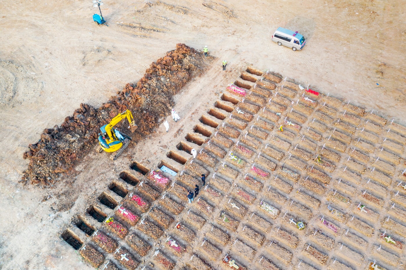 Figure 10: July 26, 2021. Aerial view of an excavation of grave pits for the burial Covid-19 victims at Rorotan graveyard in North Jakarta, Indonesia. Creativa Images / shutterstock.com