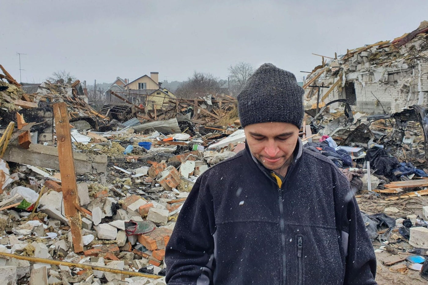 Oleg Rubak, 32, an engineer who lost his wife Katia, 29, in the shelling, stands on the rubble of his house in Zhytomyr, getty Images