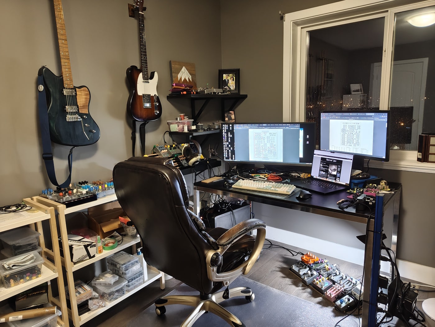 This is the whole recording space, sans drums. Most surfaces are covered with PCBs and electrical components.