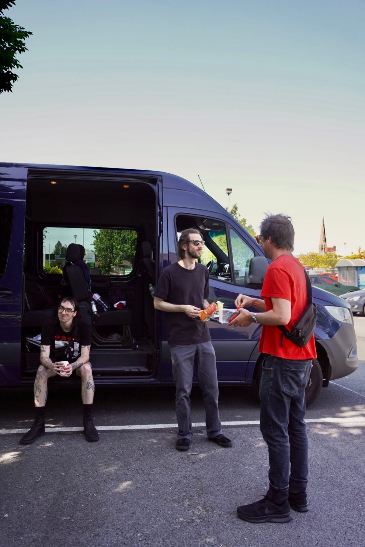 Australian synth post punks SCREENSAVER send a mid-tour dispatch from Europe, reflect on community, landlords, and why creative expression matters 6 Jonnine, Driver Dean and Chris at a pit stop